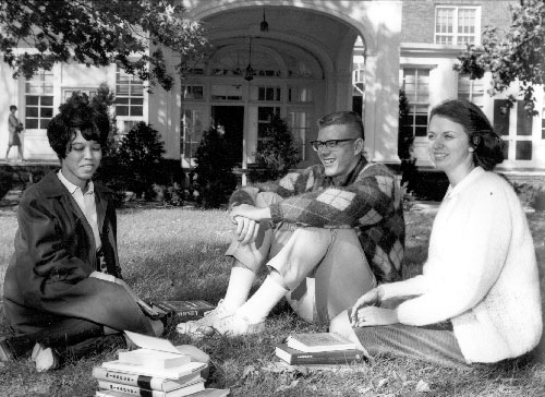 Students sitting in front of Administration building
